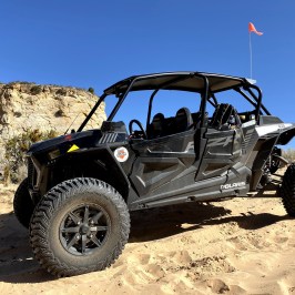 a truck driving down a dirt road