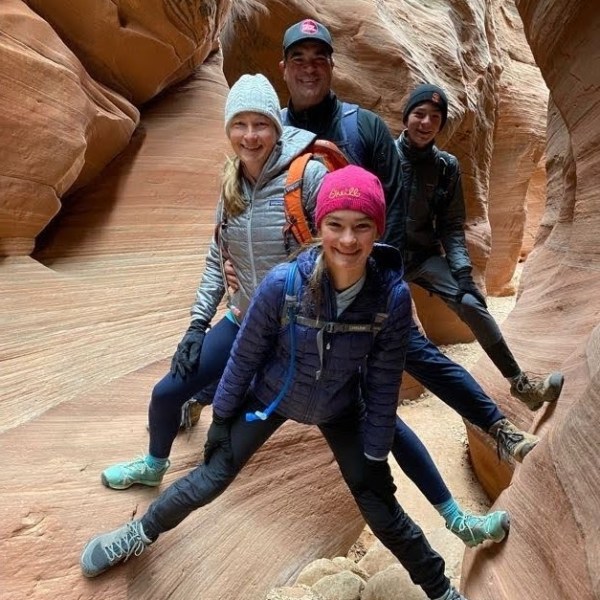 a group of people riding on the back of an elephant